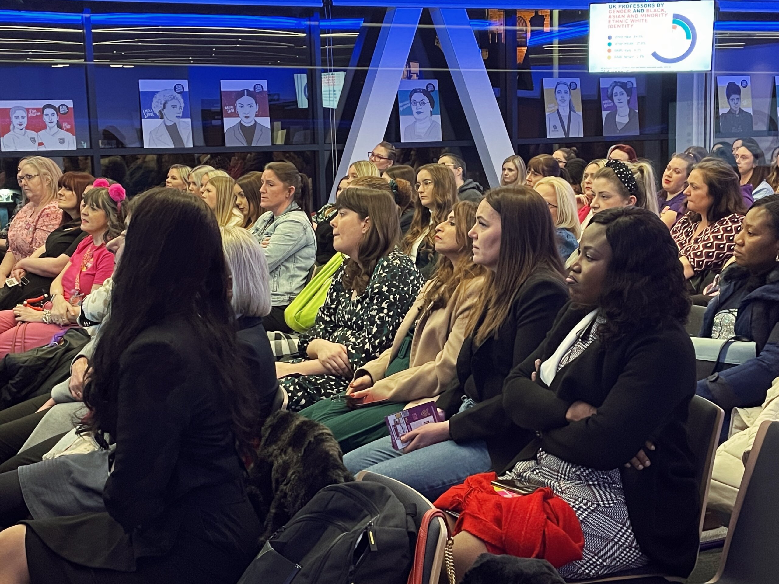 Guests are sitting and listening to the presentation