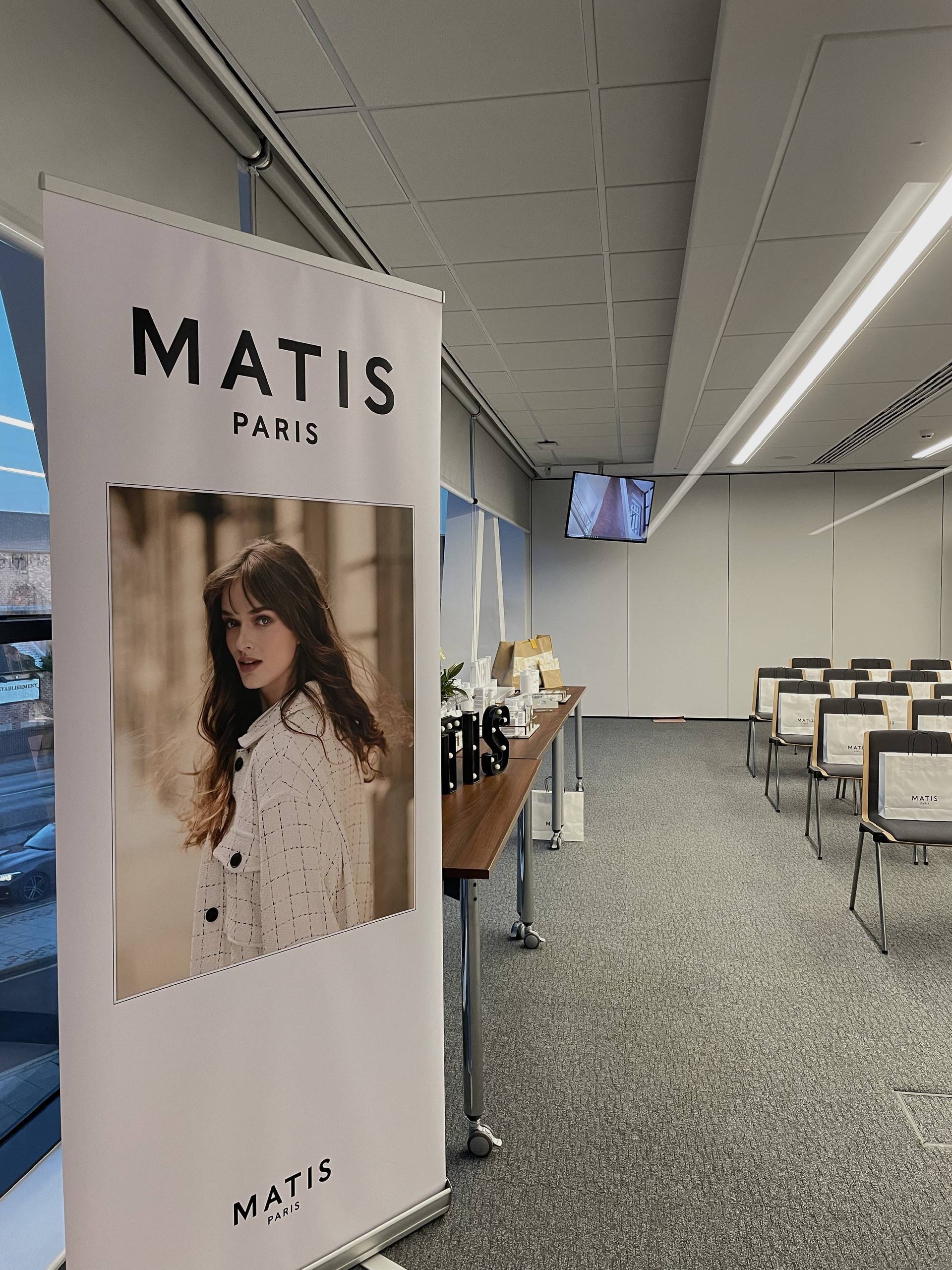 An event room with the theatre style setup for a product launching event